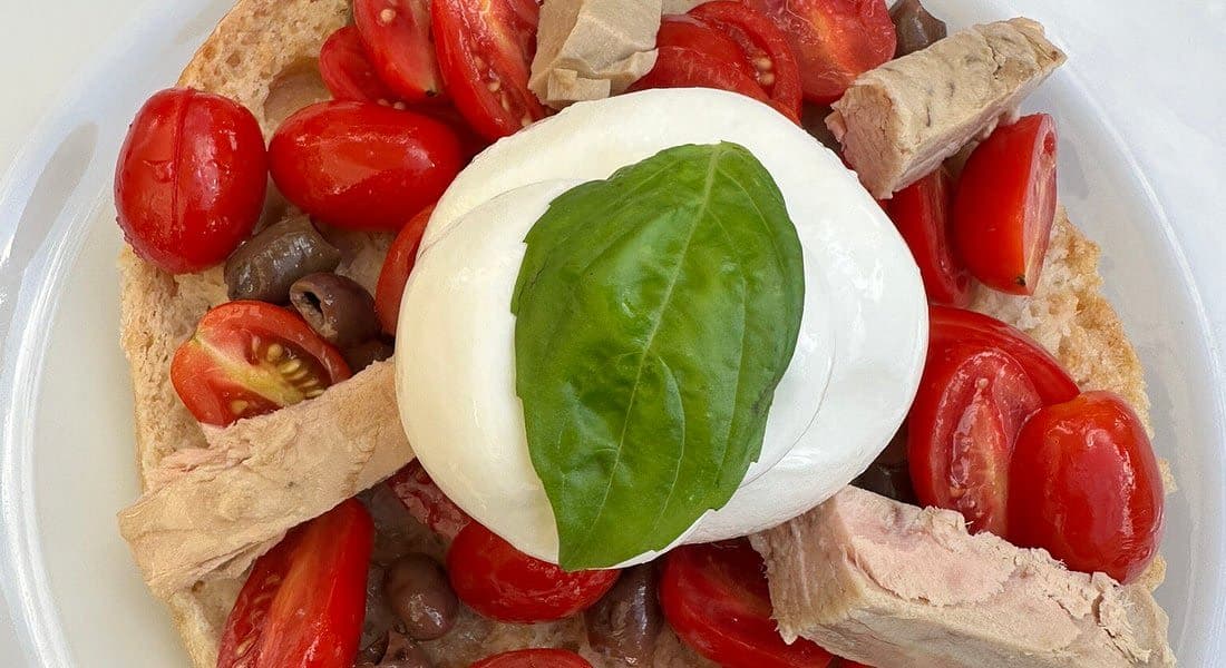 Bruschetta with burrata, tuna, cherry tomatoes and olives