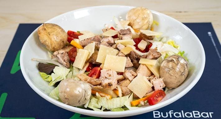 Chicken salad with cherry tomatoes and shaved cheese